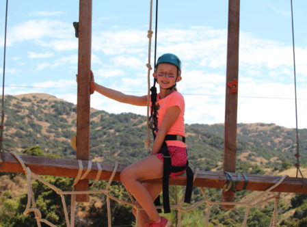 girl on ropes course