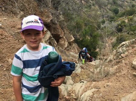 boys climbing a steep hiking trail