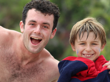 camper and counselor smiling after swimming