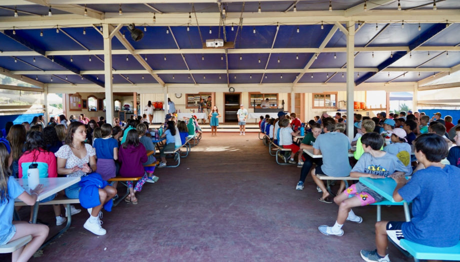 the cafeteria and eating area of CIC is under a blue awning